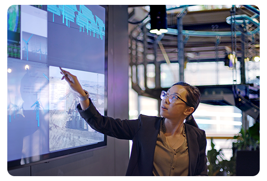 Woman pointing at a projected screen